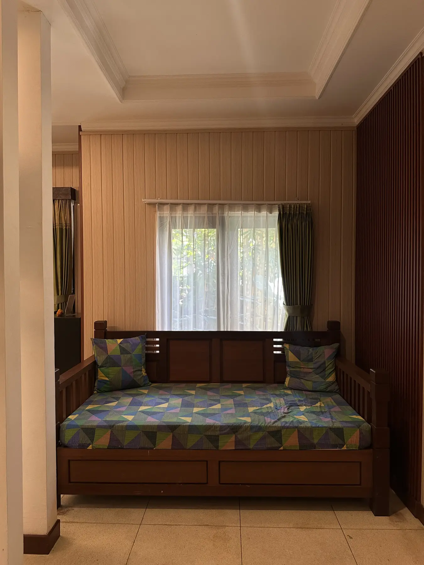 Wooden daybed inside the Junior Suite at Gita Maha Hotel