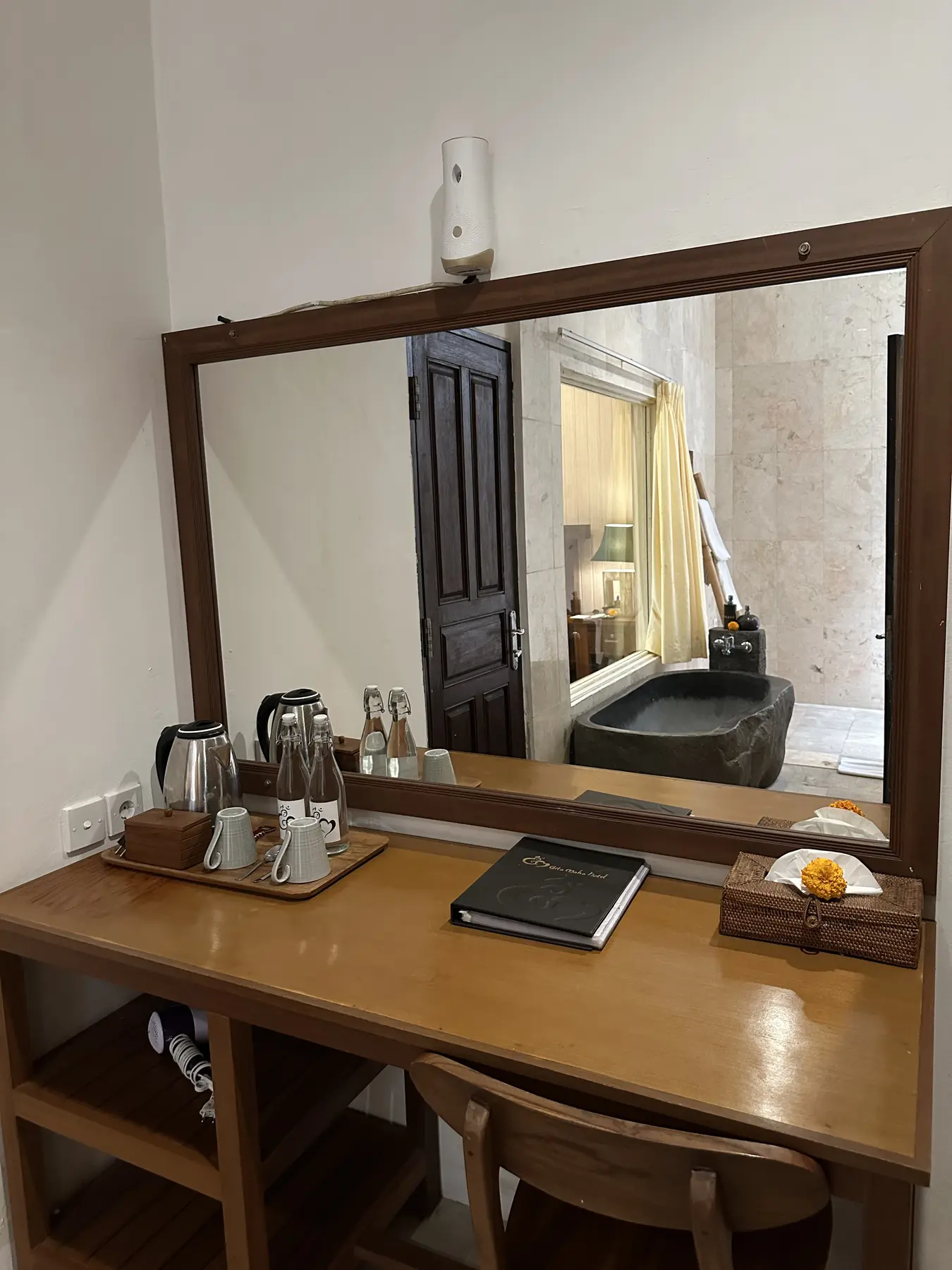 Junior Suite vanity and refreshment station with bathroom view